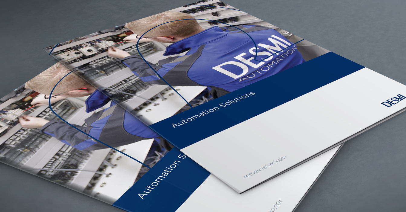 Brochures titled "DESMI Automation Solutions" featuring a technician working in a control panel.