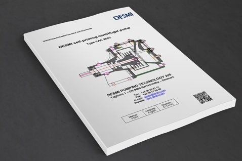 DESMI manual for self-priming centrifugal pump, Type VAC-2001, on a gray surface.