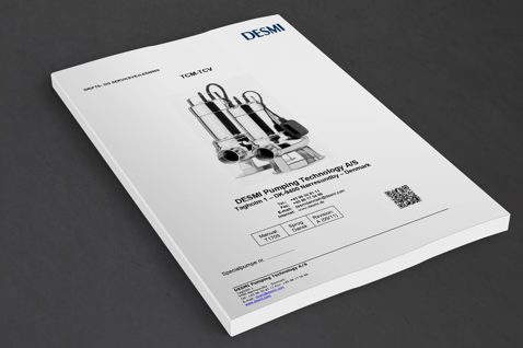 Manual cover for DESMI TCM-TCV pump, featuring contact information and QR code.